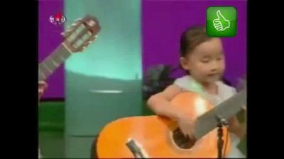 Корейские дети зажигают на гитарах,North Korea children playing the guitar. Creepy as hell