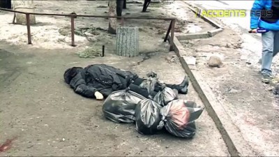 18+ В Донецке снаряды попали в остановку и троллейбус, много погибших