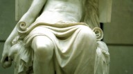 The statue illustrated is Le Jeunesse d'Aristote by Charles Degeorge -