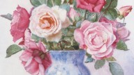 Still life with roses in a white and blue vase